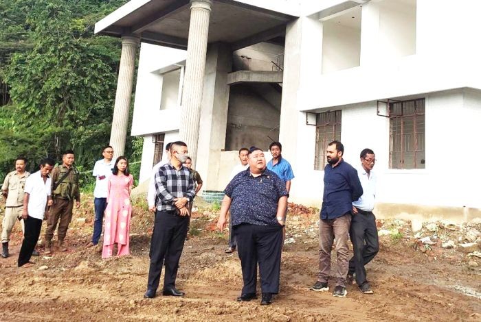 Minister Temjen Imna Along with others during their visit to the ongoing construction of Model college and renovation work at Community Health Center, Mangkolemba. (DIPR Photo)